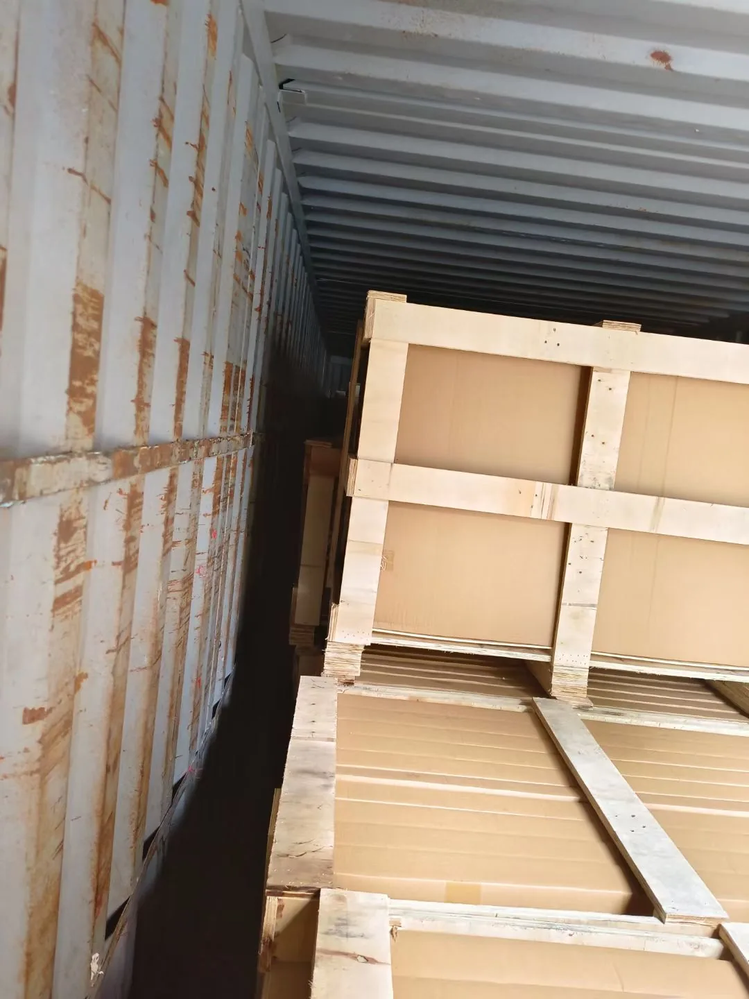 Wooden export crates loaded inside a shipping container
